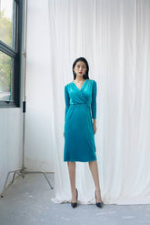 Velvet wrap-front midi dress with ruched waist and long sleeves for elegant evening wear